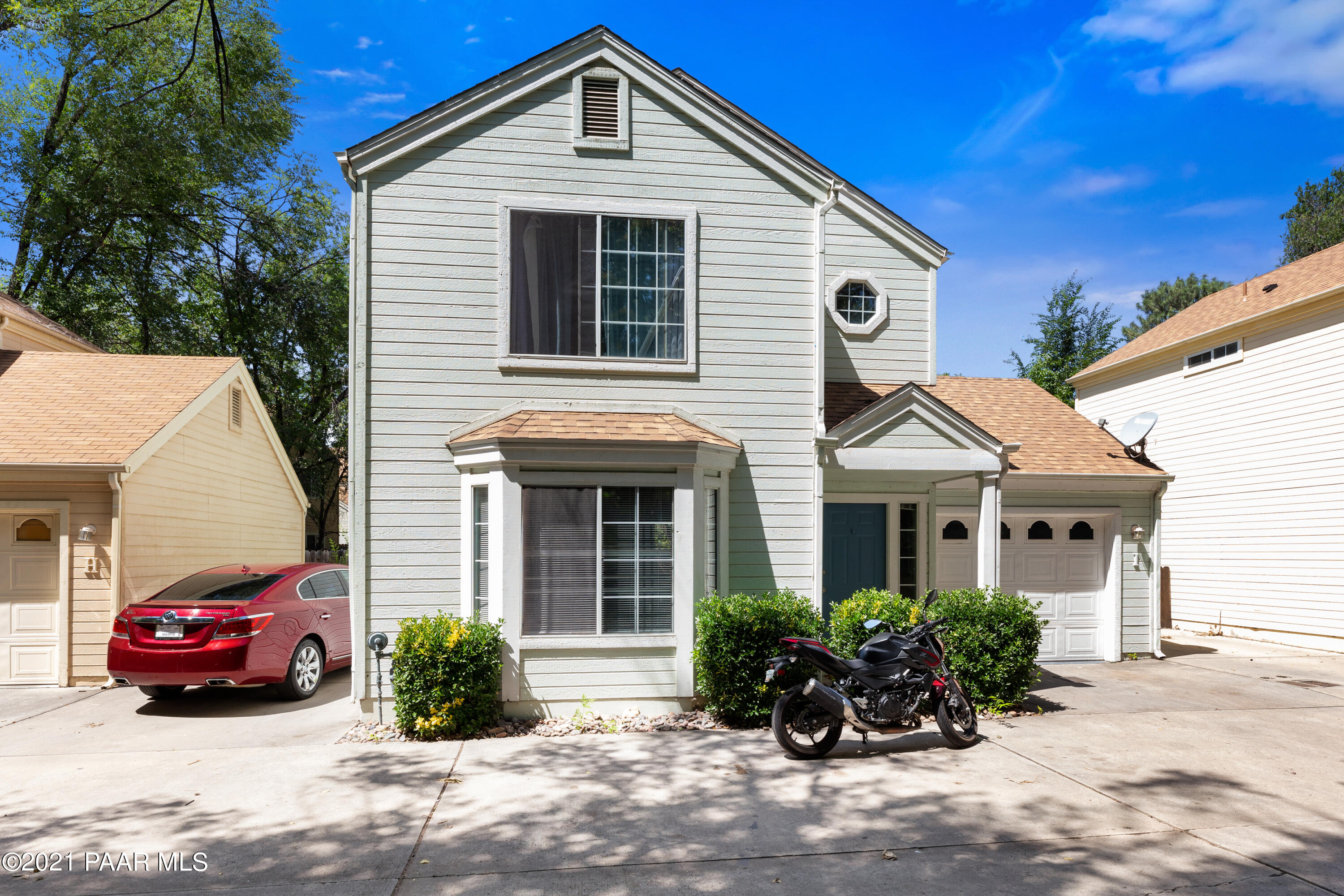741 Gail Gardner Way, Unit I Prescott, AZ 86305 - Photo 2 of 16 a front view of a house with a yard