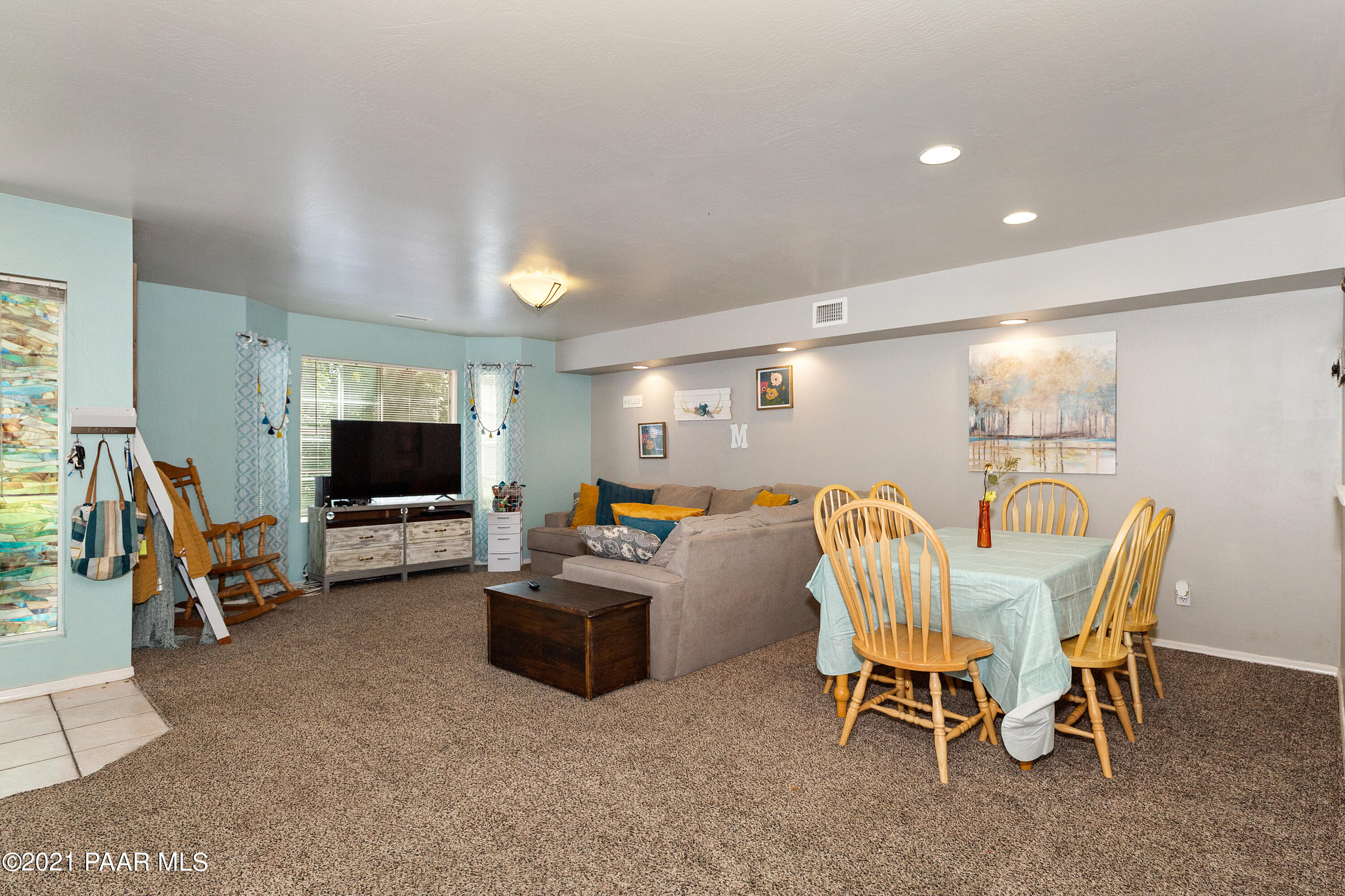 741 Gail Gardner Way, Unit I Prescott, AZ 86305 - Photo 7 of 16 a view of a livingroom with furniture and a flat screen tv