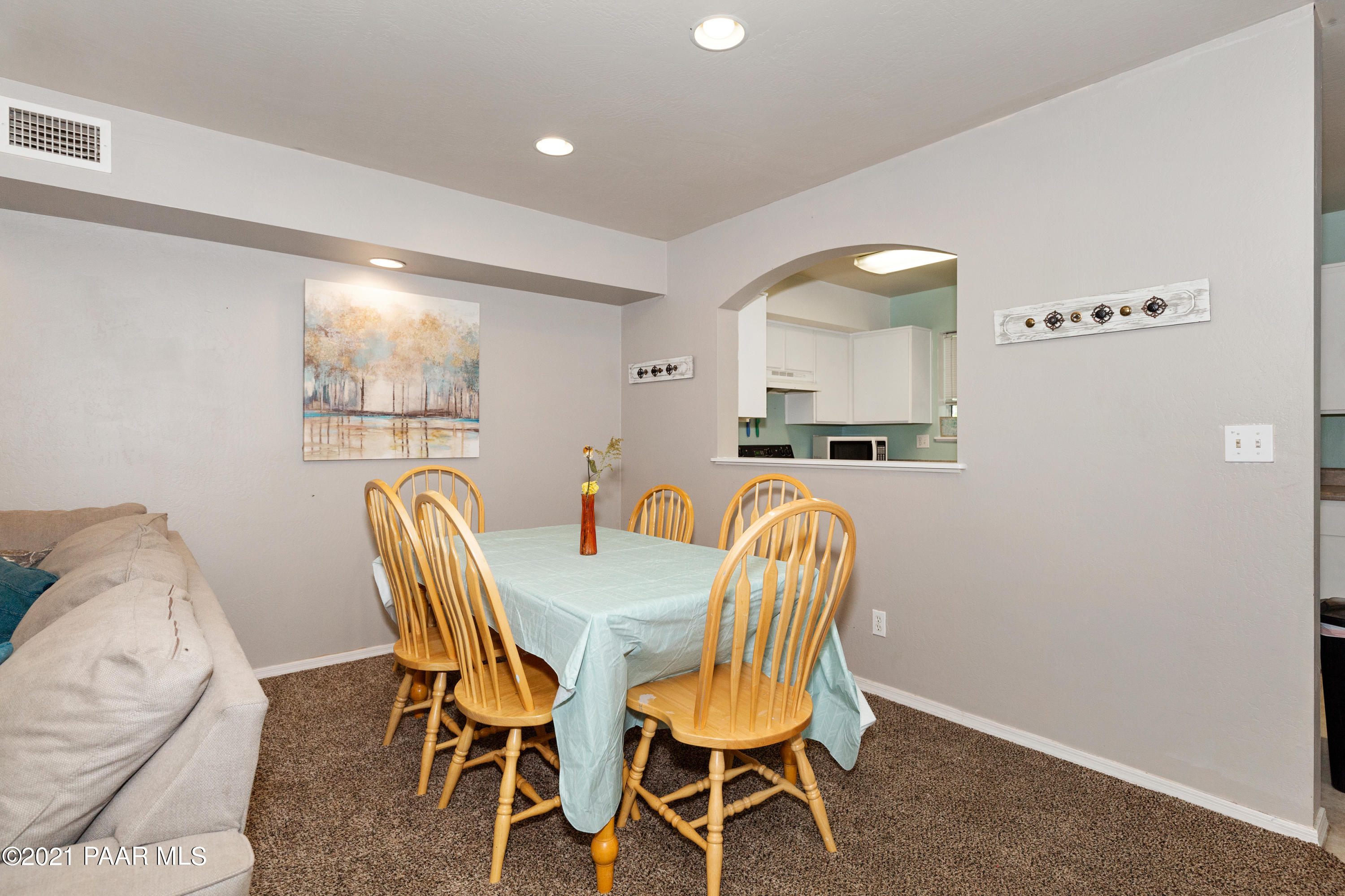 741 Gail Gardner Way, Unit I Prescott, AZ 86305 - Photo 8 of 16 a dining room with furniture and window
