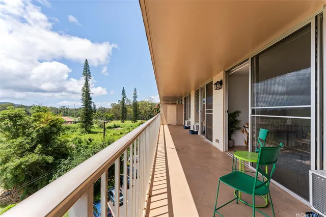 a view of balcony with furniture
