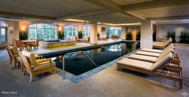 a view of a patio with a table and chairs