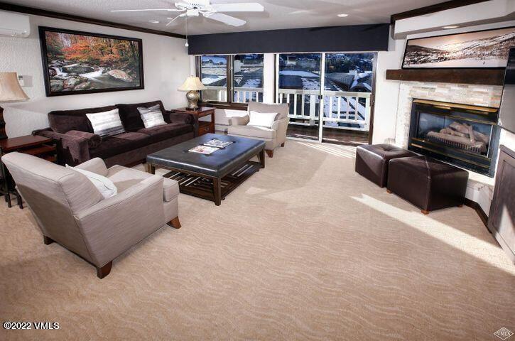 210 Offerson Road, Unit 21235&36 Beaver Creek, CO 81620 - Photo 2 of 16 a living room with furniture and a fireplace