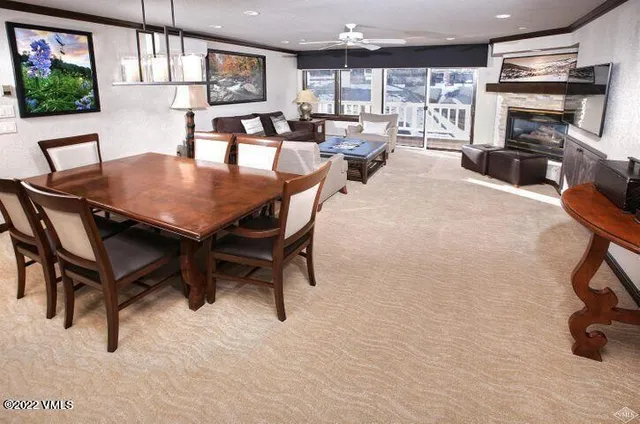 a view of a dining room with furniture window and outside view