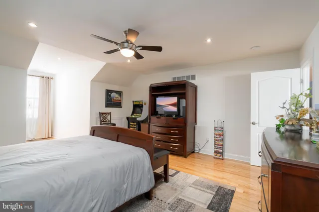 a bedroom with a bed and a dresser