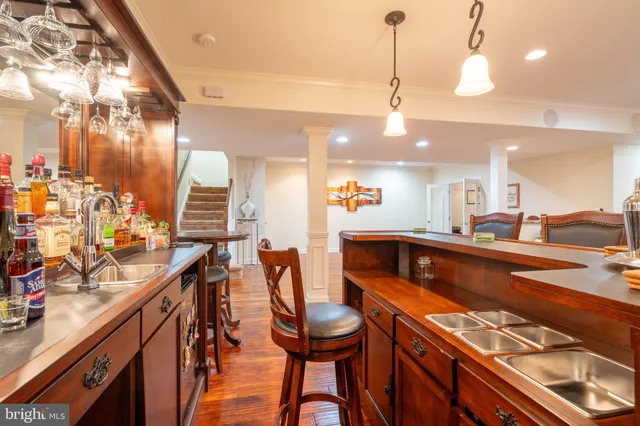 a kitchen with stainless steel appliances kitchen island granite countertop a stove a sink and a refrigerator