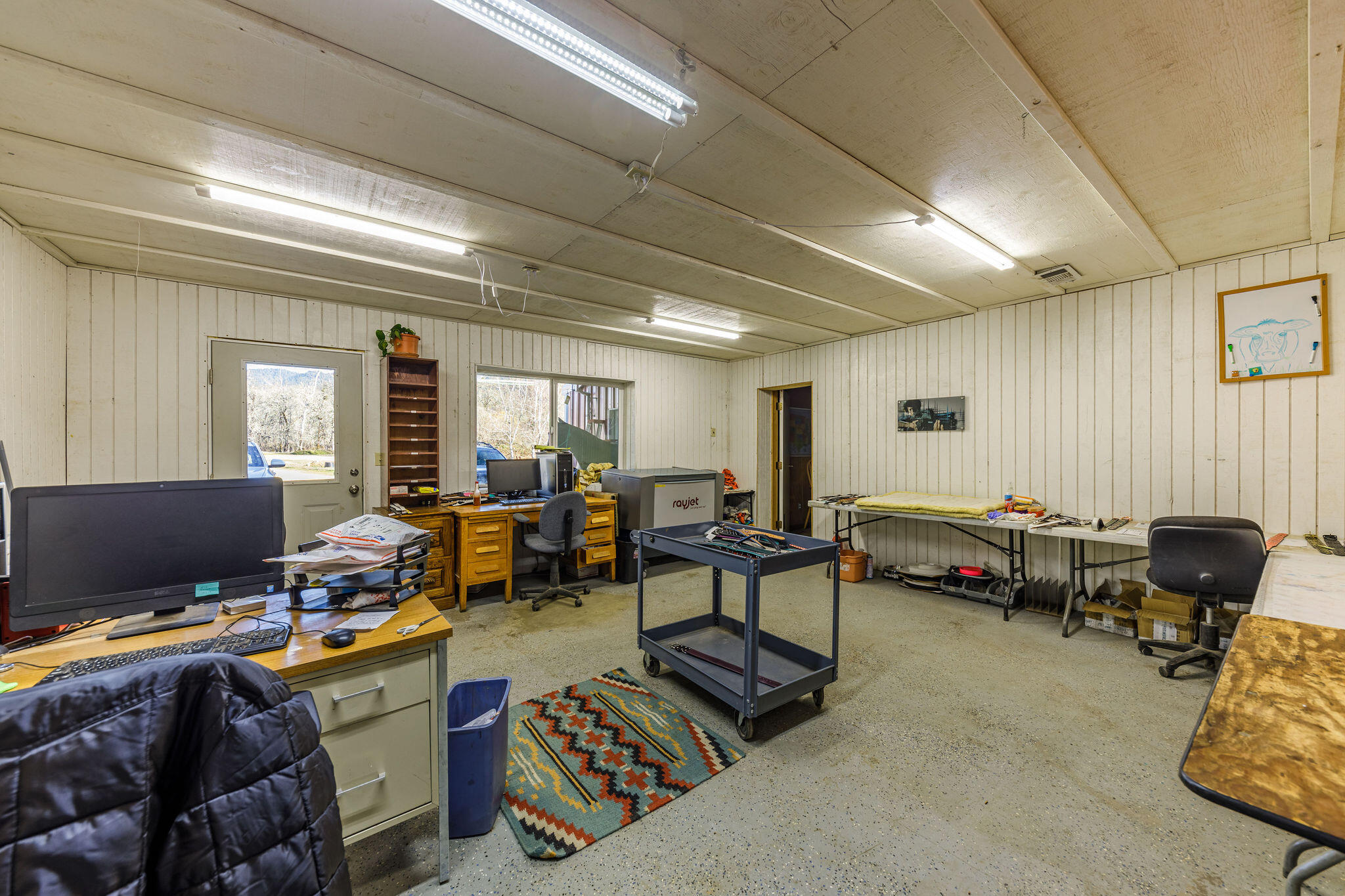 6790 Holland Loop Road Cave Junction, OR 97523 - Photo 52 of 151 a living room with lots of furniture and a window