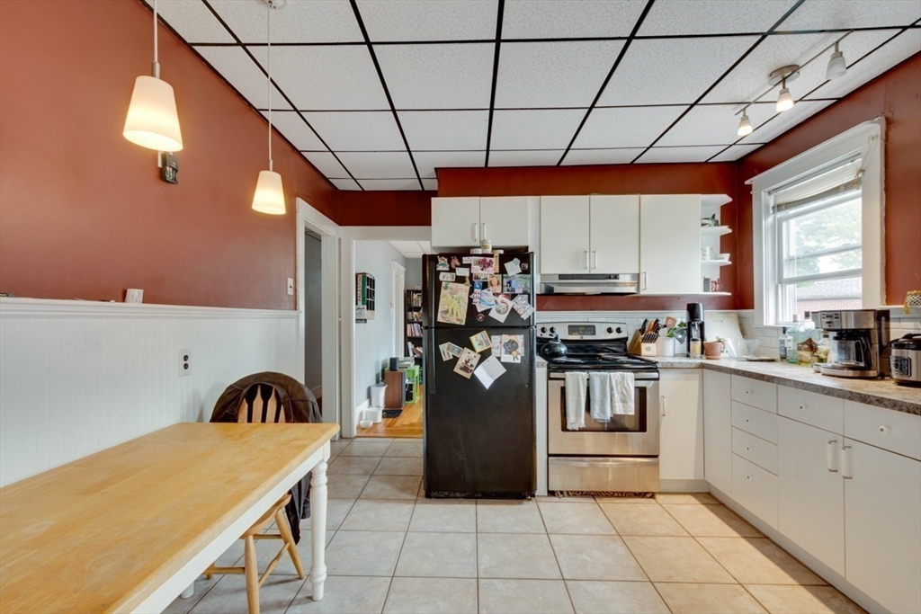 45 Jackson Road Somerville, MA 02145 - Photo 21 of 27 a kitchen with a sink a counter and appliances