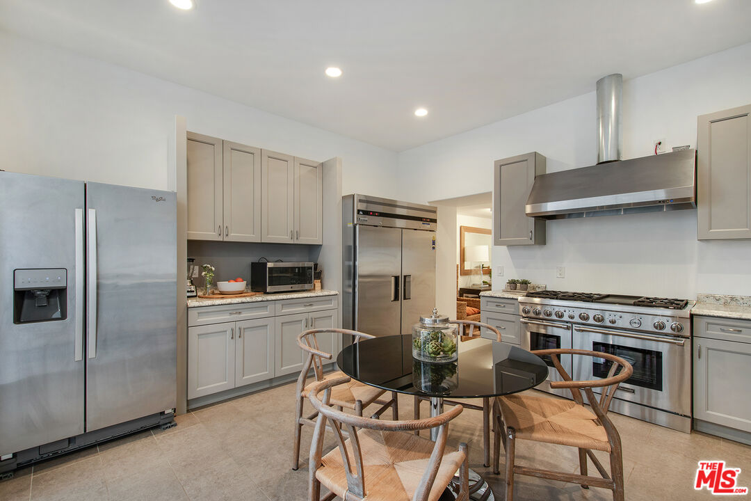 9696 Antelope Road Beverly Hills, CA 90210 - Photo 18 of 29 a kitchen with stainless steel appliances a stove a refrigerator and a refrigerator