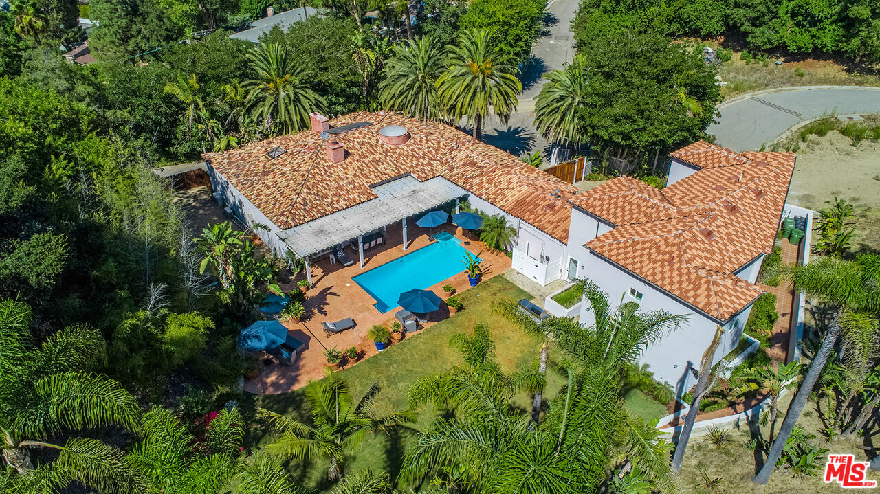 9696 Antelope Road Beverly Hills, CA 90210 - Photo 2 of 29 an aerial view of a house with a yard and swimming pool