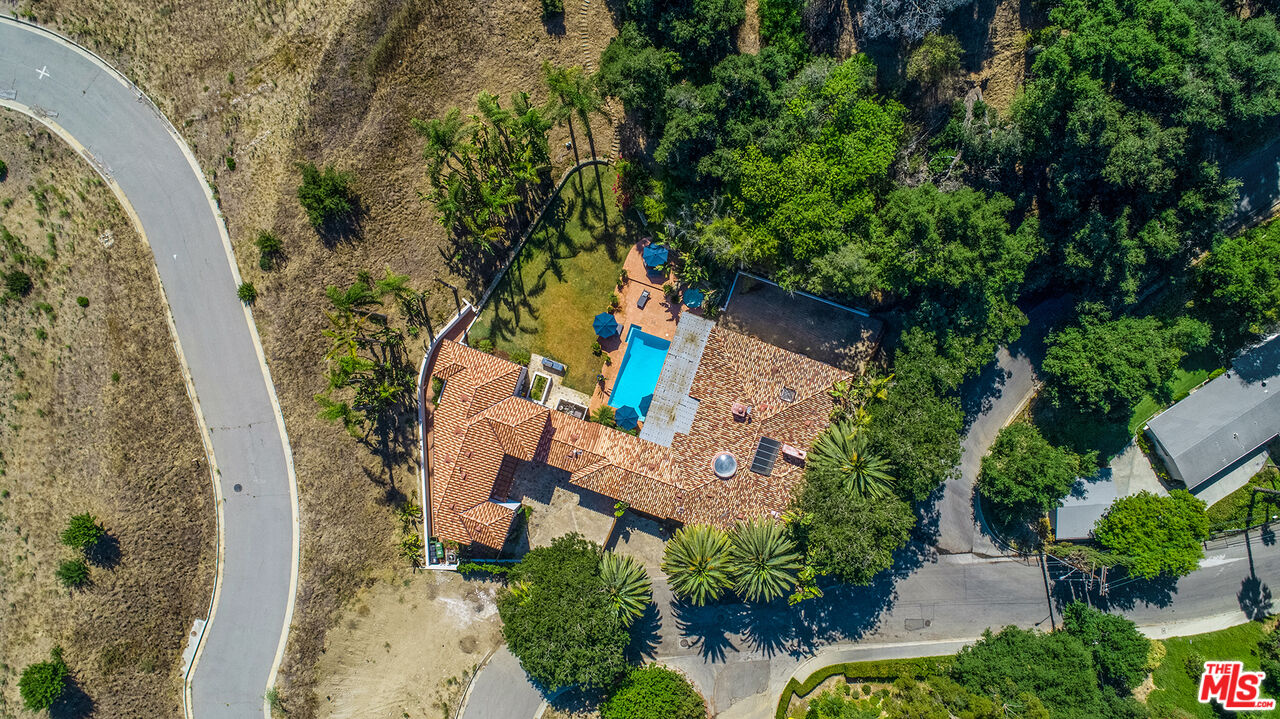 9696 Antelope Road Beverly Hills, CA 90210 - Photo 24 of 29 an aerial view of a house with a yard and garden