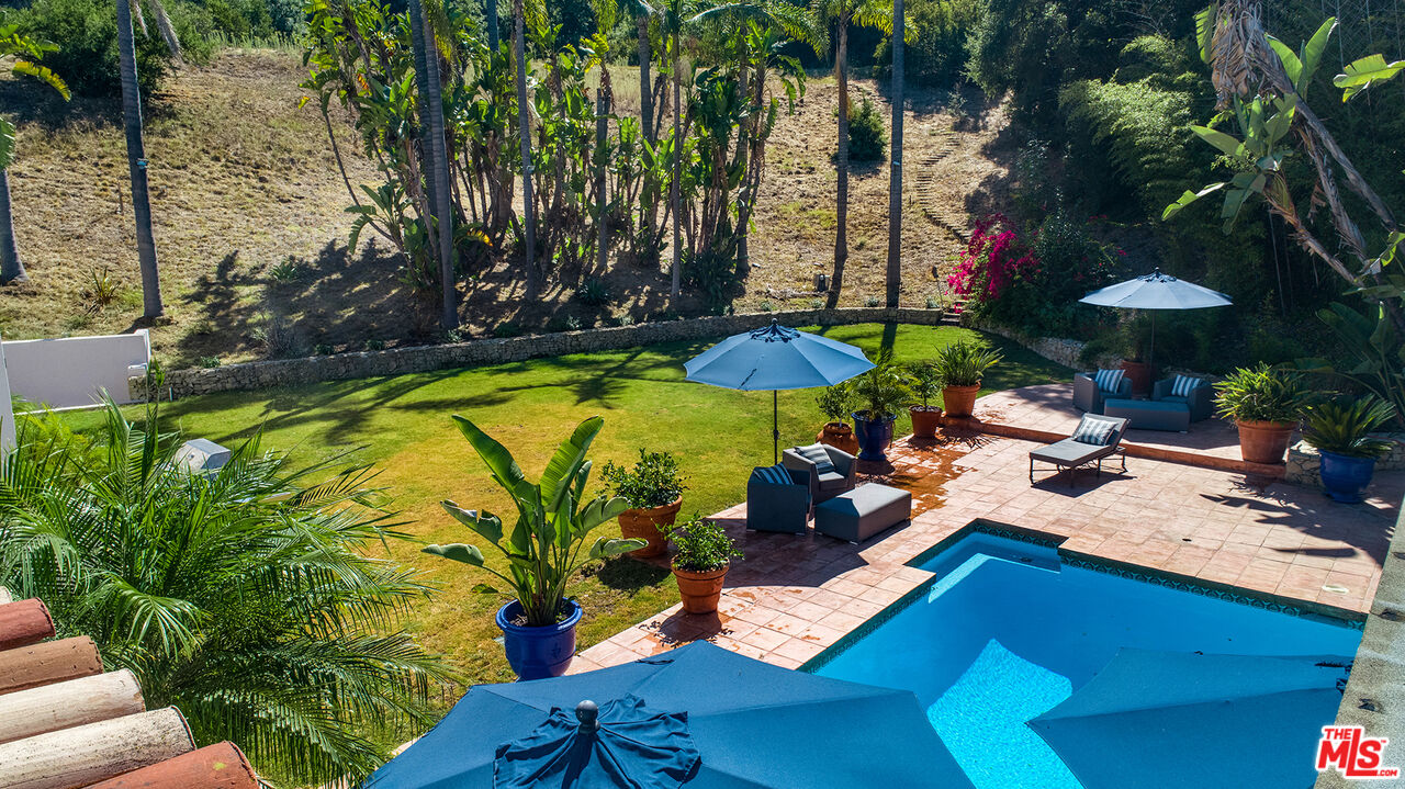 9696 Antelope Road Beverly Hills, CA 90210 - Photo 25 of 29 a view of swimming pool with outdoor seating