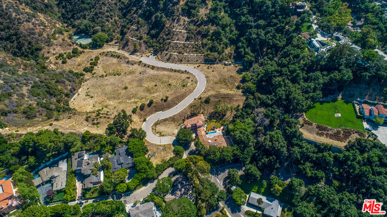 9696 Antelope Road Beverly Hills, CA 90210 - Photo 29 of 29 an aerial view of a house with a yard and large trees