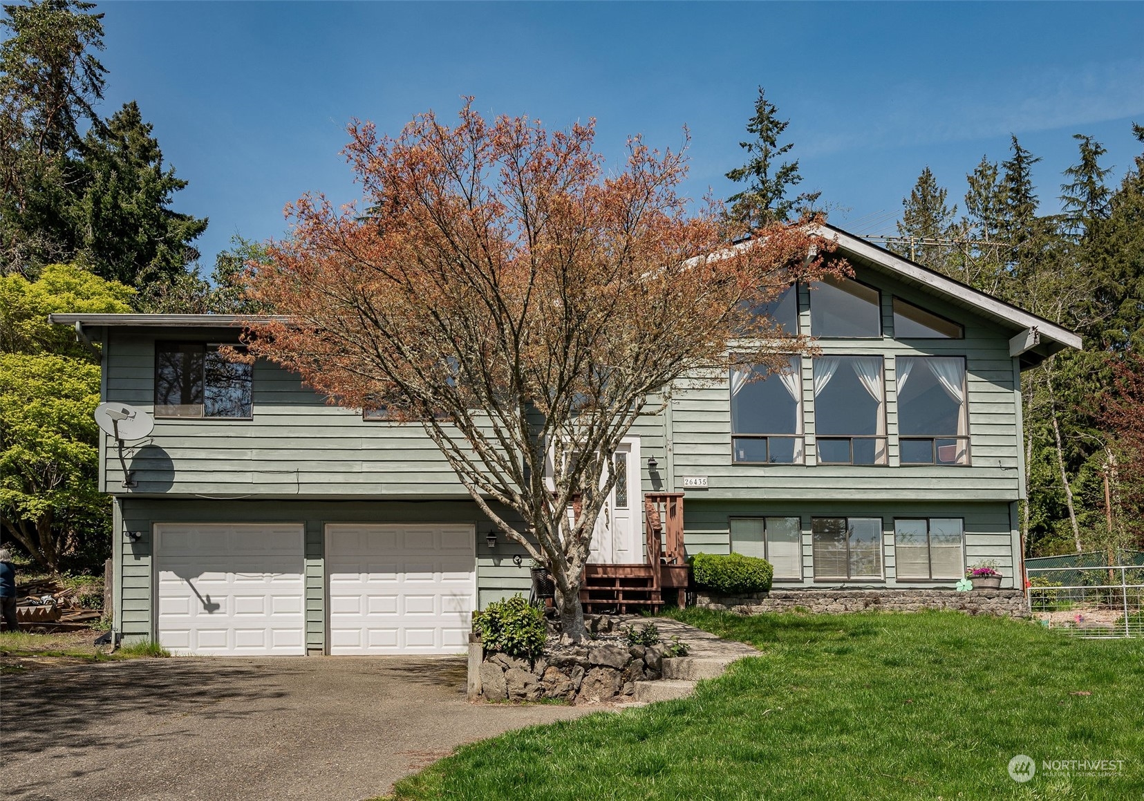 26435 Kingsview Loop Northeast Kingston, WA 98346 - Photo 1 of 25 a view of a house with a yard