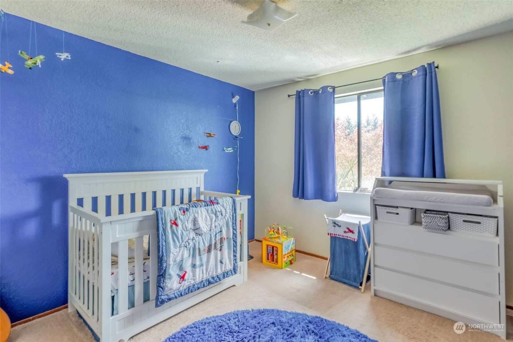 26435 Kingsview Loop Northeast Kingston, WA 98346 - Photo 15 of 25 a bedroom with furniture and a window