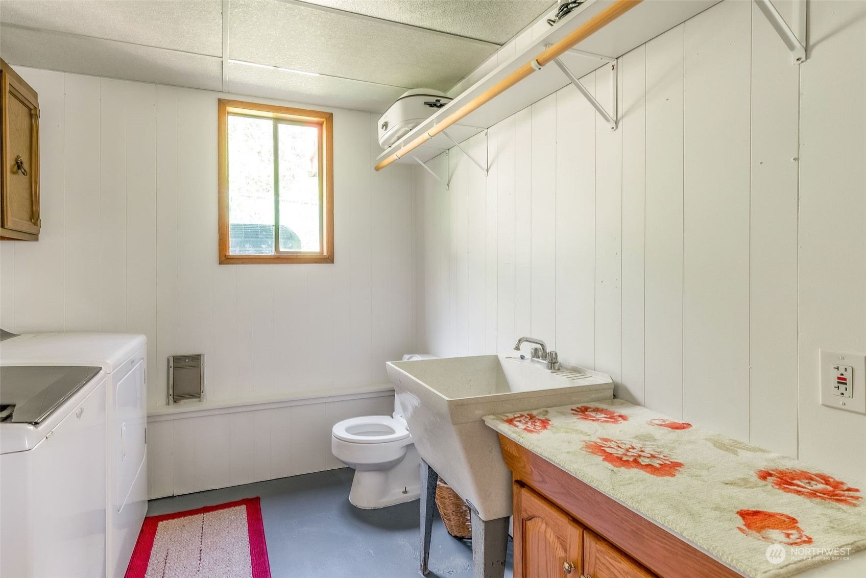 26435 Kingsview Loop Northeast Kingston, WA 98346 - Photo 16 of 25 a bathroom with a sink a toilet and a shower
