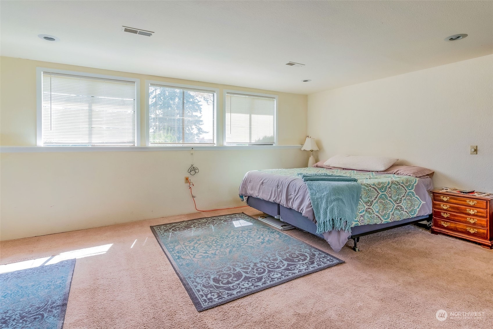 26435 Kingsview Loop Northeast Kingston, WA 98346 - Photo 18 of 25 a bedroom with a bed a table and window