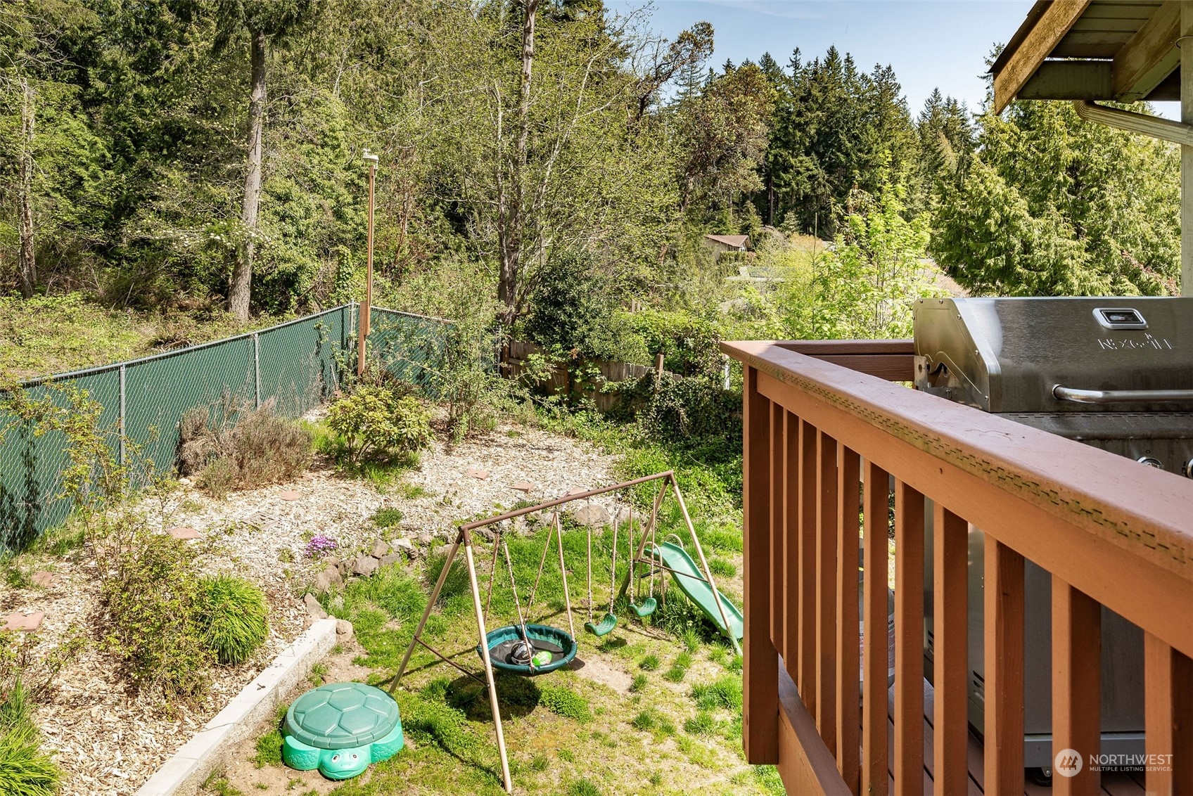 26435 Kingsview Loop Northeast Kingston, WA 98346 - Photo 25 of 25 a view of balcony with wooden floor and fence