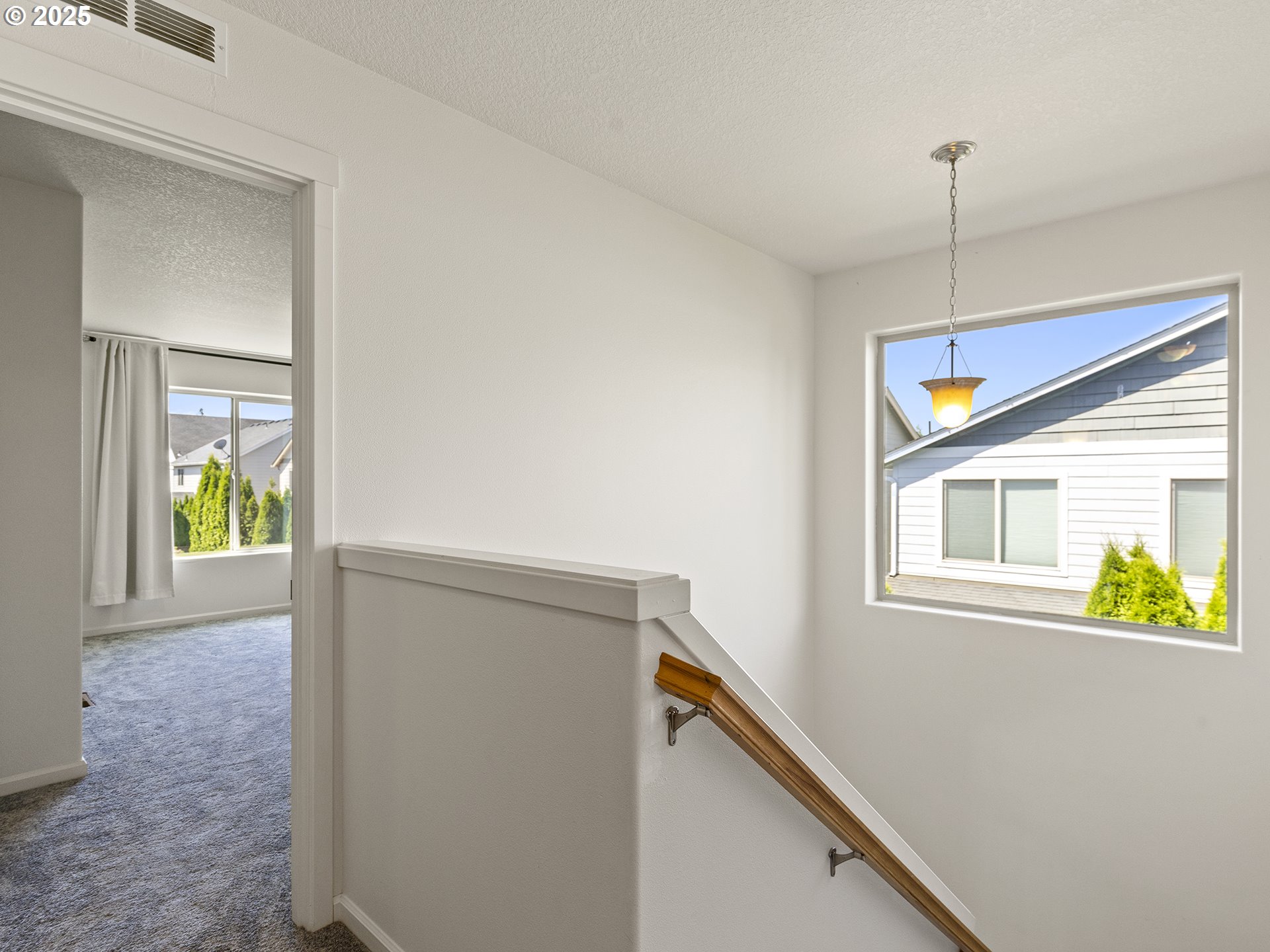 3805 North 3rd Circle Ridgefield, WA 98642 - Photo 11 of 30 a view of an entryway with wooden floor and a window