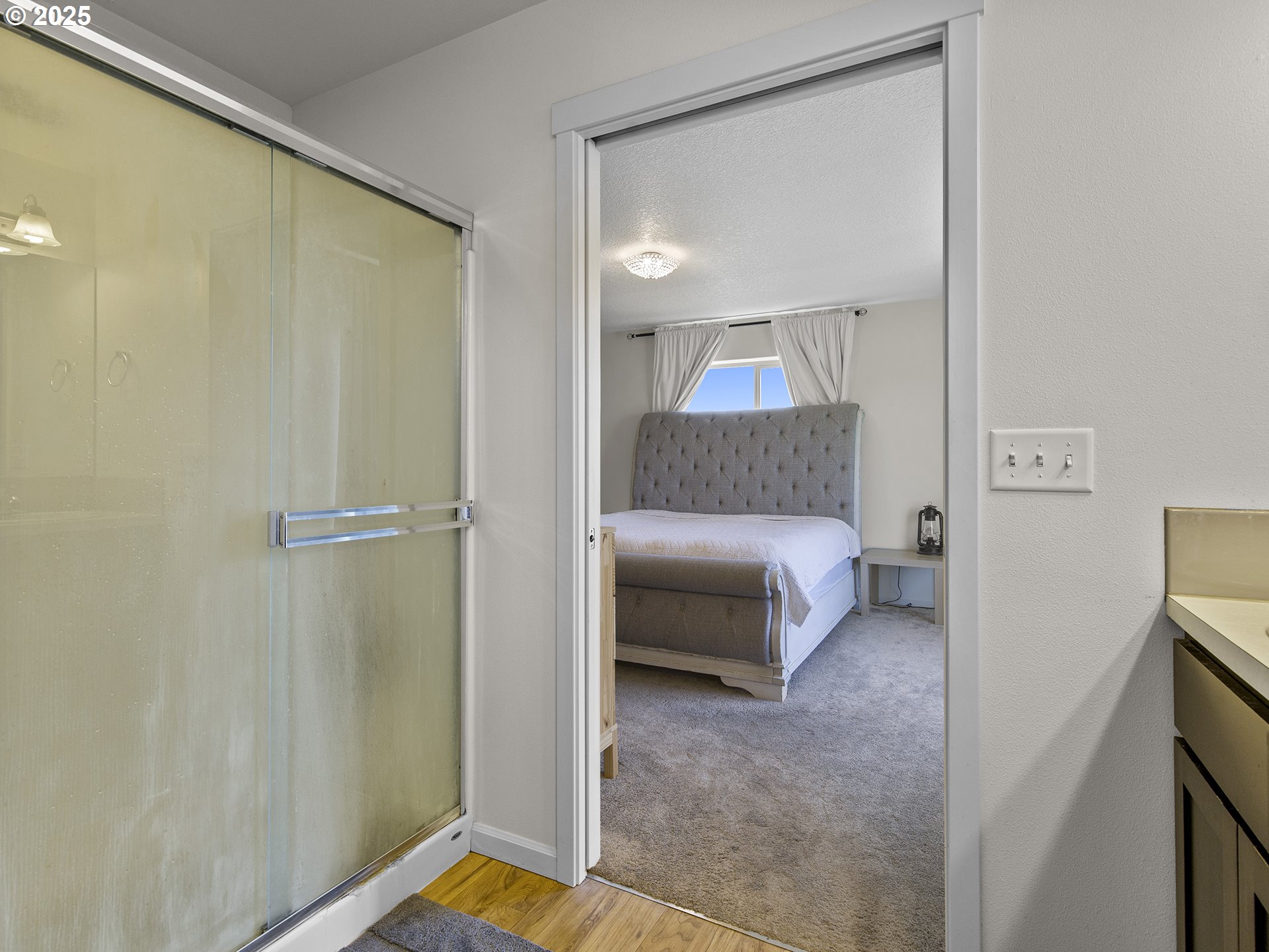 3805 North 3rd Circle Ridgefield, WA 98642 - Photo 15 of 30 a bedroom with a bed and a mirror