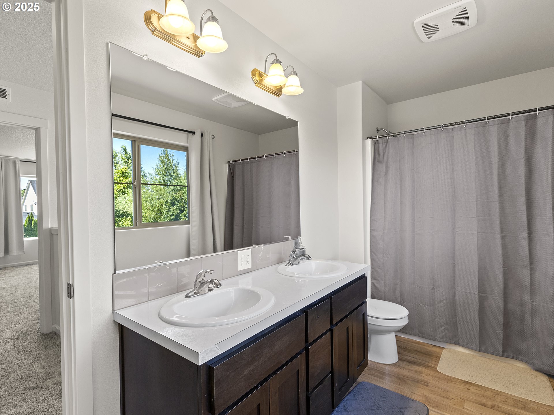 3805 North 3rd Circle Ridgefield, WA 98642 - Photo 18 of 30 a bathroom with a sink and a mirror