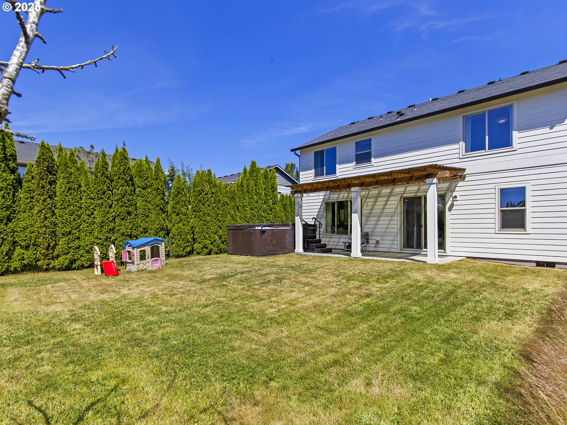 3805 North 3rd Circle Ridgefield, WA 98642 - Photo 24 of 30 a view of an house with backyard and tree