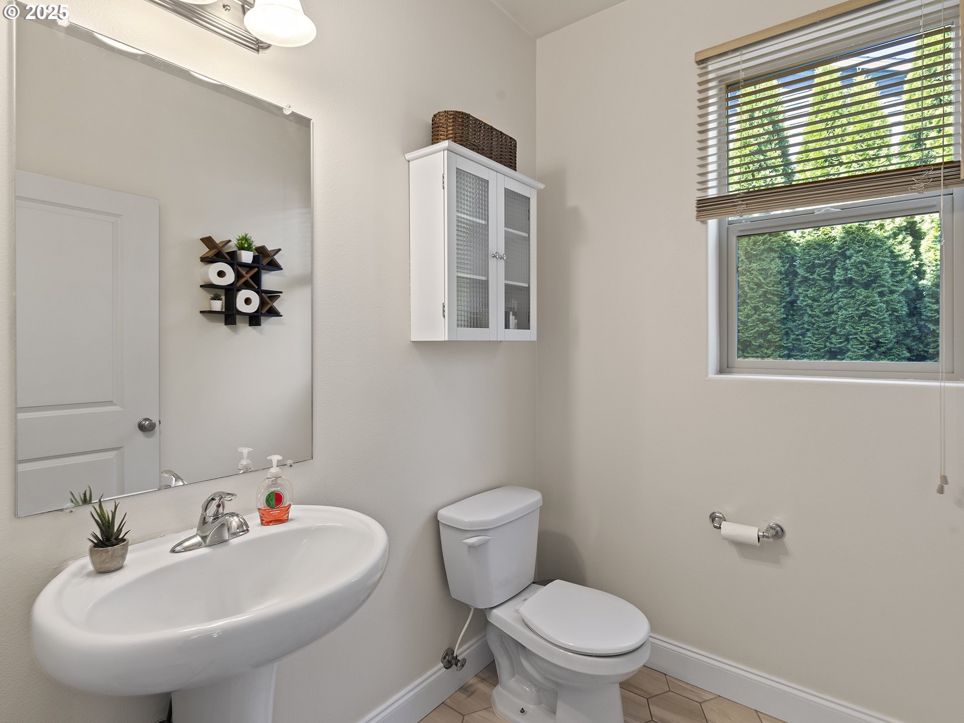 3805 North 3rd Circle Ridgefield, WA 98642 - Photo 9 of 30 a bathroom with a sink a mirror and a toilet