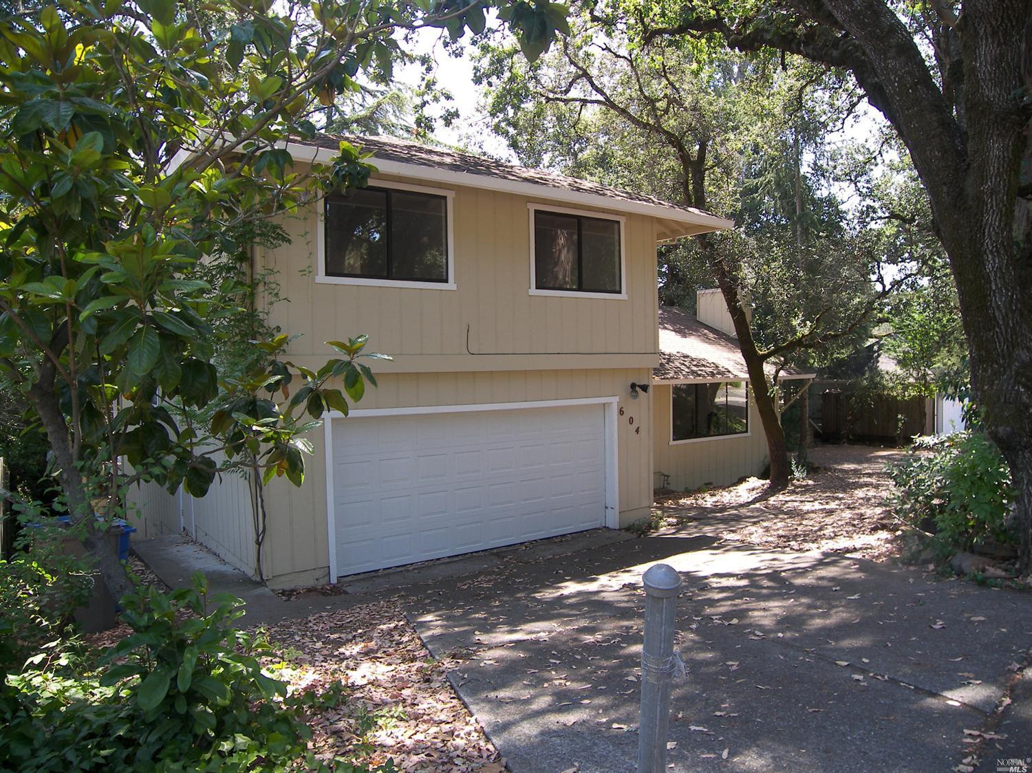 604 Los Olivos Road Santa Rosa, CA 95404 - Photo 1 of 1 a view of a house with a tree in the yard