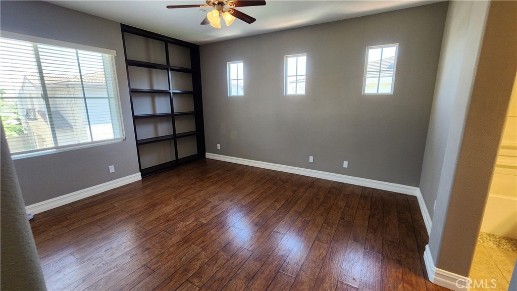 3 Camino Celeste San Clemente, CA 92673 - Photo 11 of 16 an empty room with wooden floor and windows