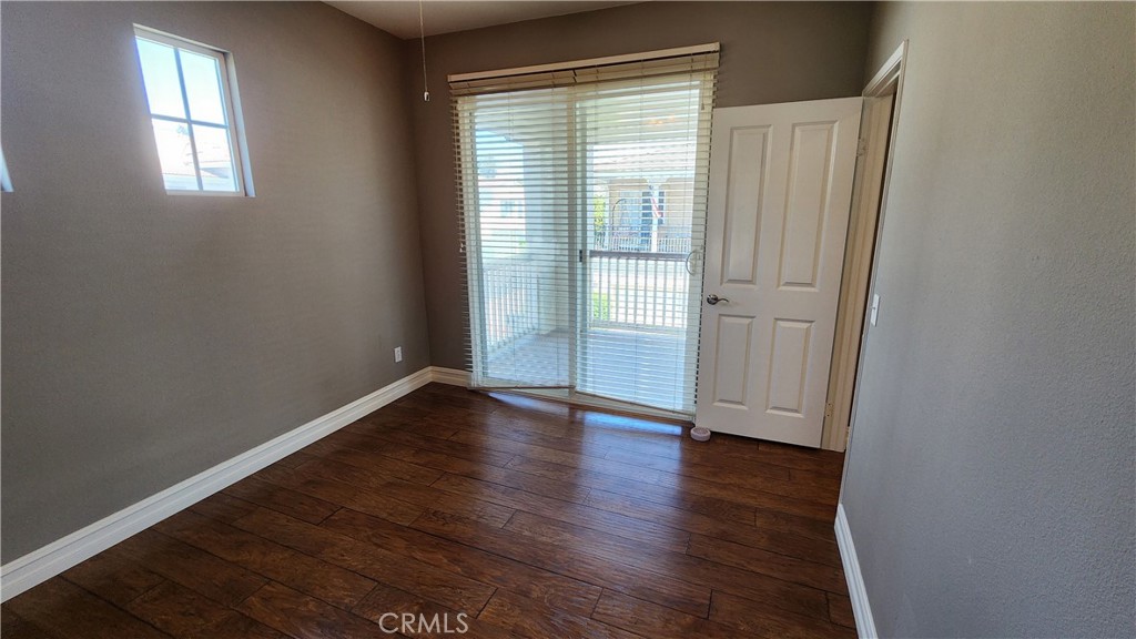 3 Camino Celeste San Clemente, CA 92673 - Photo 15 of 16 an empty room with wooden floor and windows