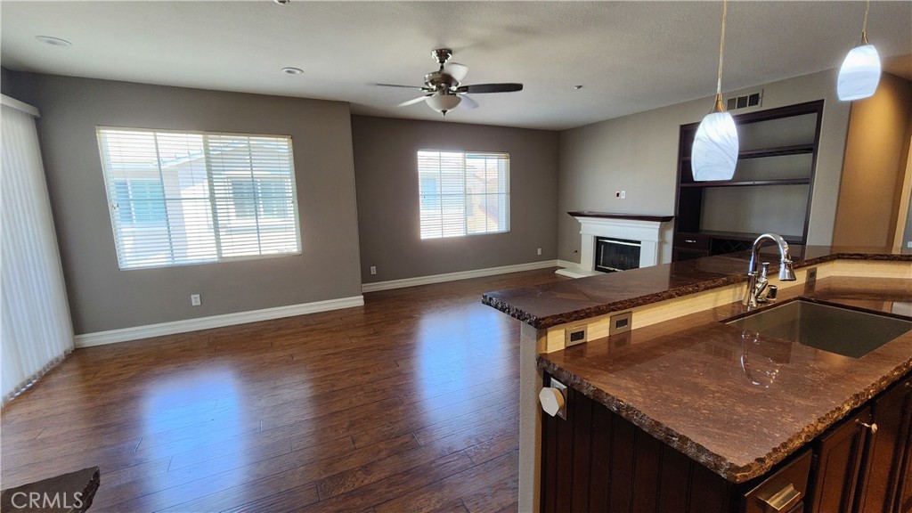 3 Camino Celeste San Clemente, CA 92673 - Photo 7 of 16 a kitchen with sink wooden floor dining table and chairs