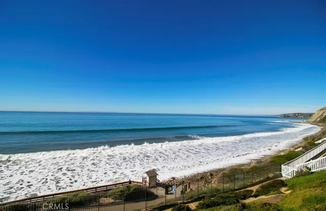 a view of a balcony with an ocean view