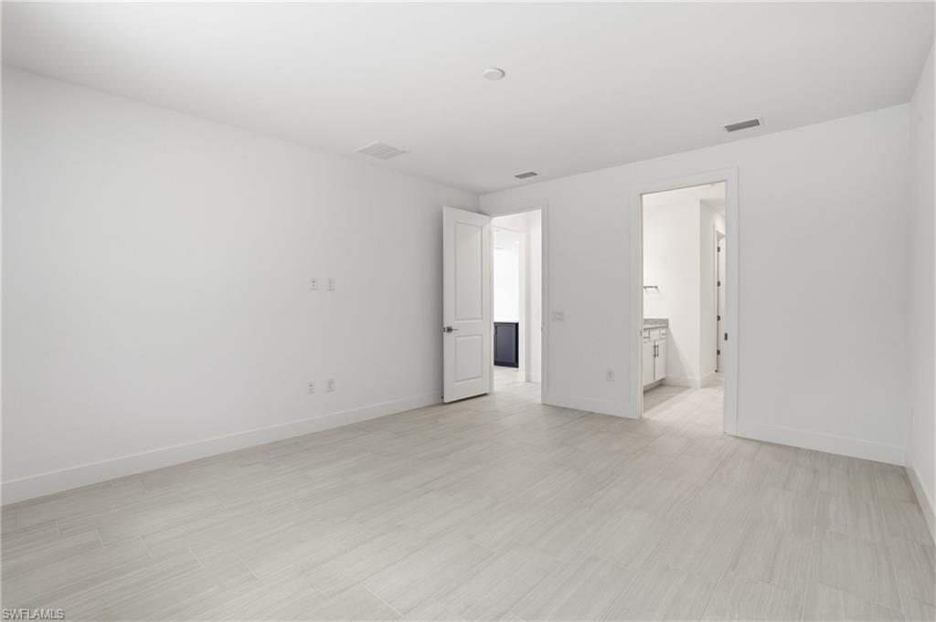 2148 Sequoia Court Naples, FL 34113 - Photo 11 of 48 a view of an empty room