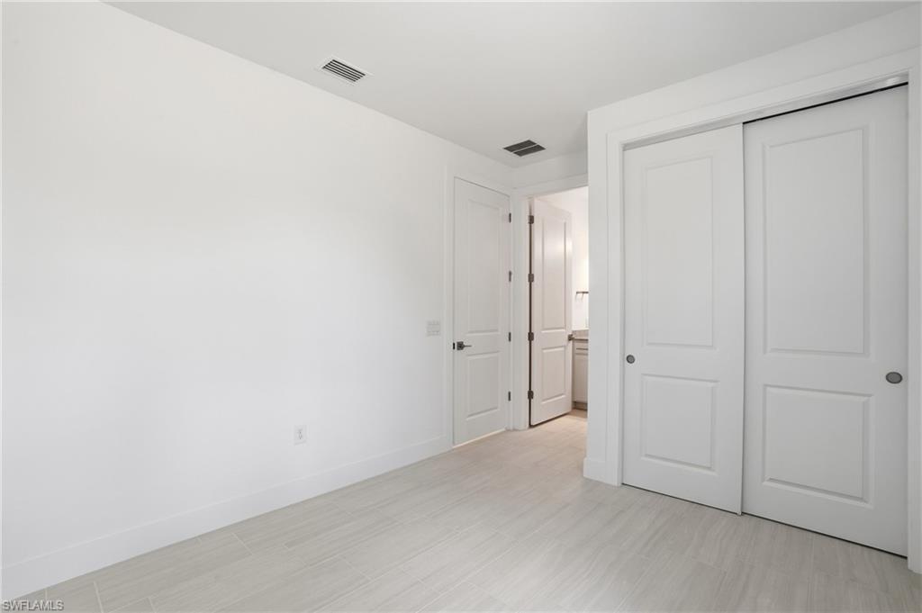 2148 Sequoia Court Naples, FL 34113 - Photo 22 of 48 a view of an empty room
