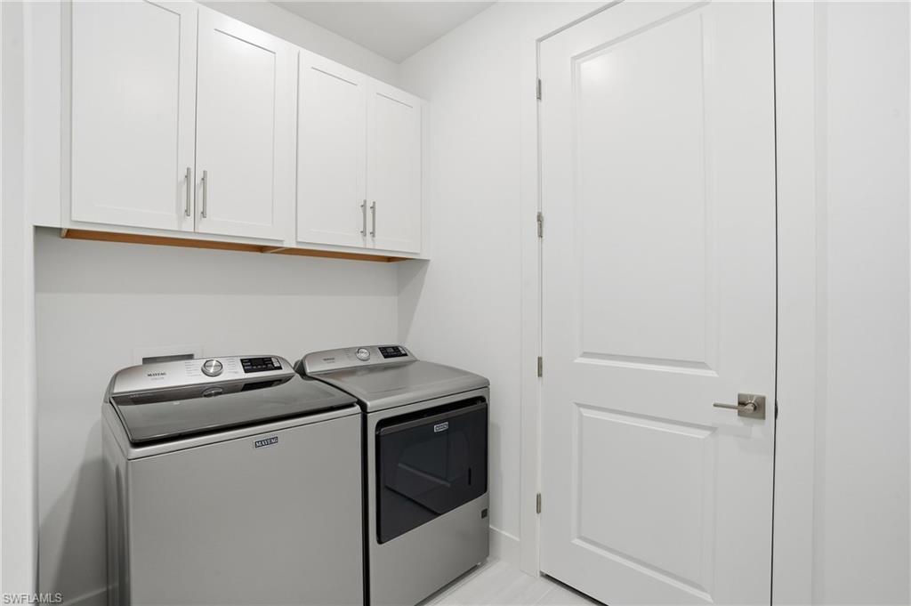2148 Sequoia Court Naples, FL 34113 - Photo 26 of 48 a utility room with dryer and washer