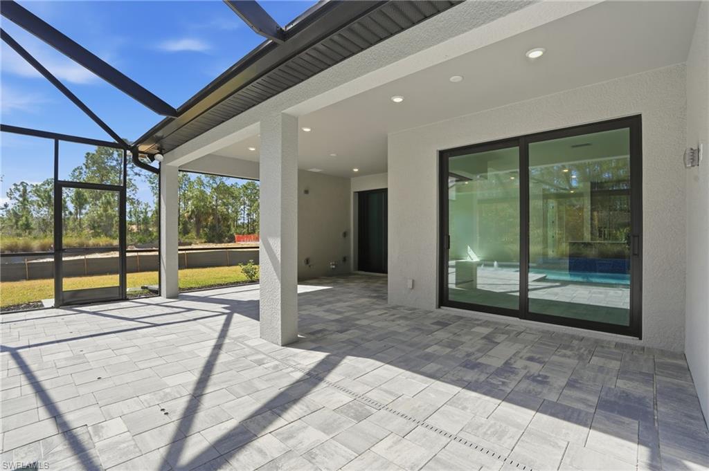 2148 Sequoia Court Naples, FL 34113 - Photo 35 of 48 a view of a swimming pool with a porch