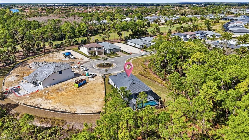 2148 Sequoia Court Naples, FL 34113 - Photo 37 of 48 an aerial view of residential house with outdoor space and trees all around