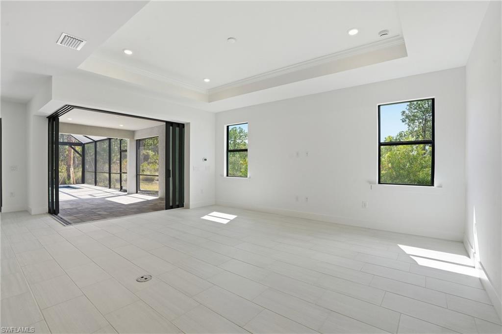 2148 Sequoia Court Naples, FL 34113 - Photo 4 of 48 a view of an empty room with a window