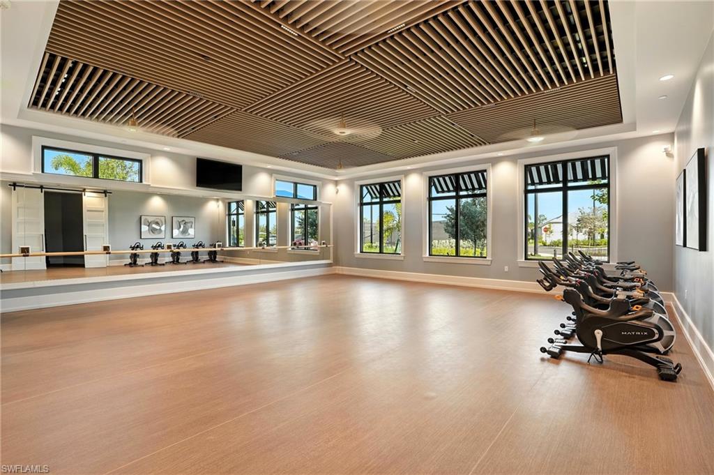 2148 Sequoia Court Naples, FL 34113 - Photo 46 of 48 a lobby with furniture and floor to ceiling window