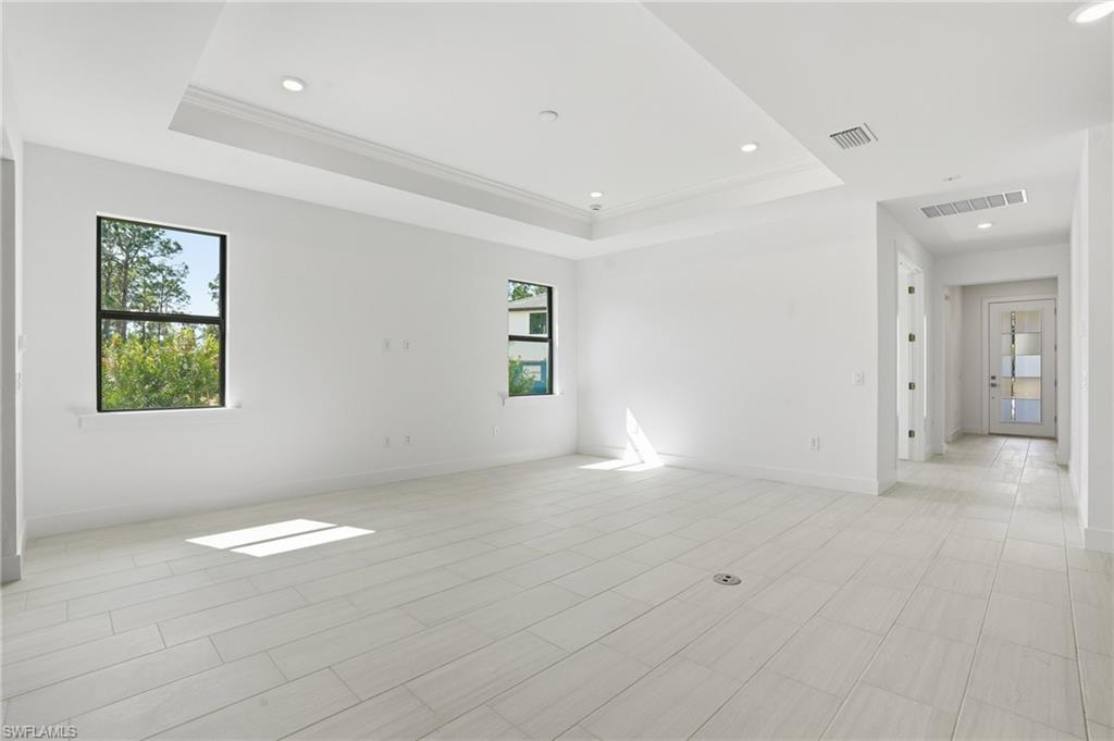 2148 Sequoia Court Naples, FL 34113 - Photo 5 of 48 an empty room with windows
