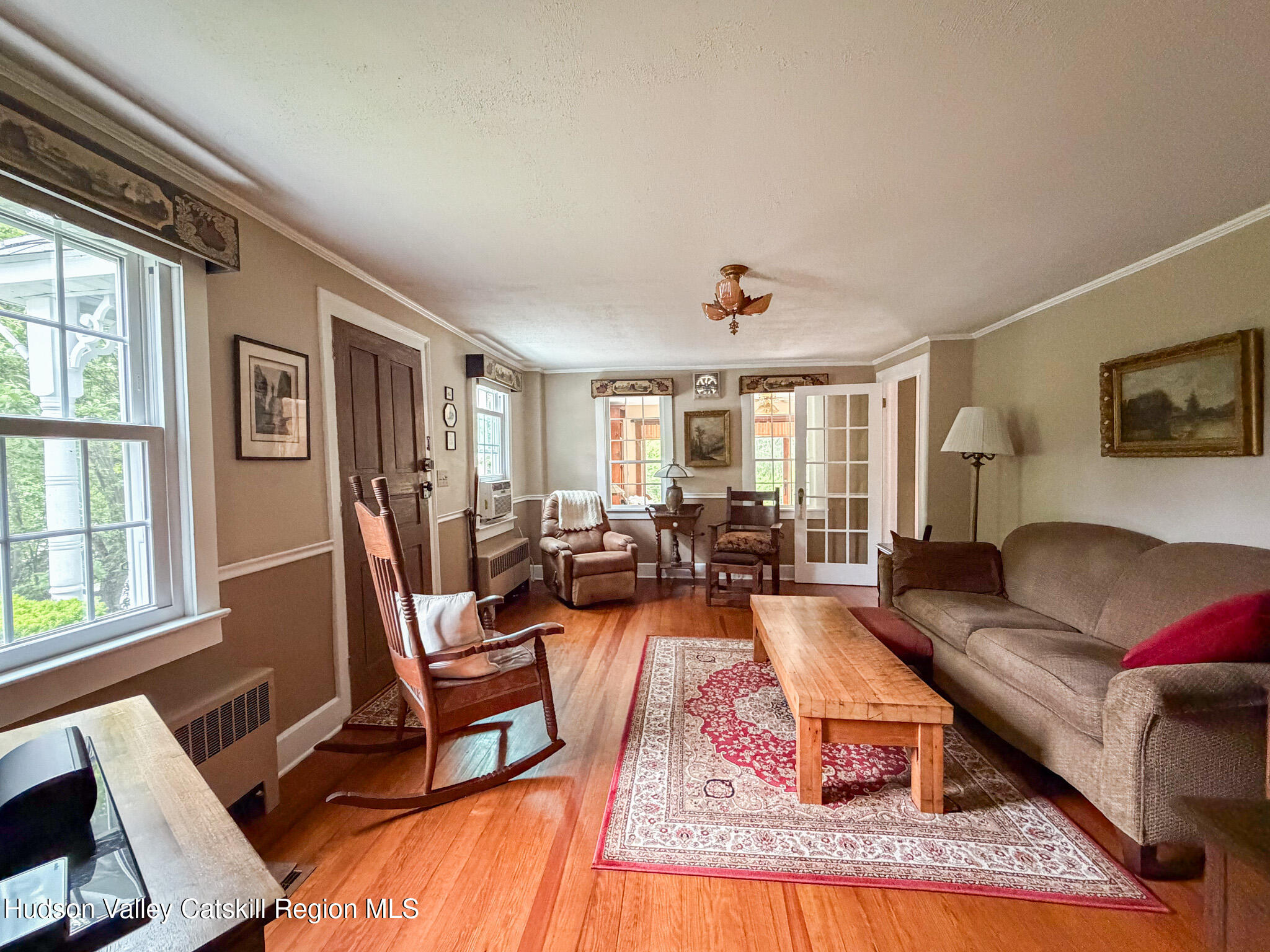 221 Camp Medusa Road Rensselaerville, NY 12120 - Photo 10 of 57 a living room with furniture and a large window