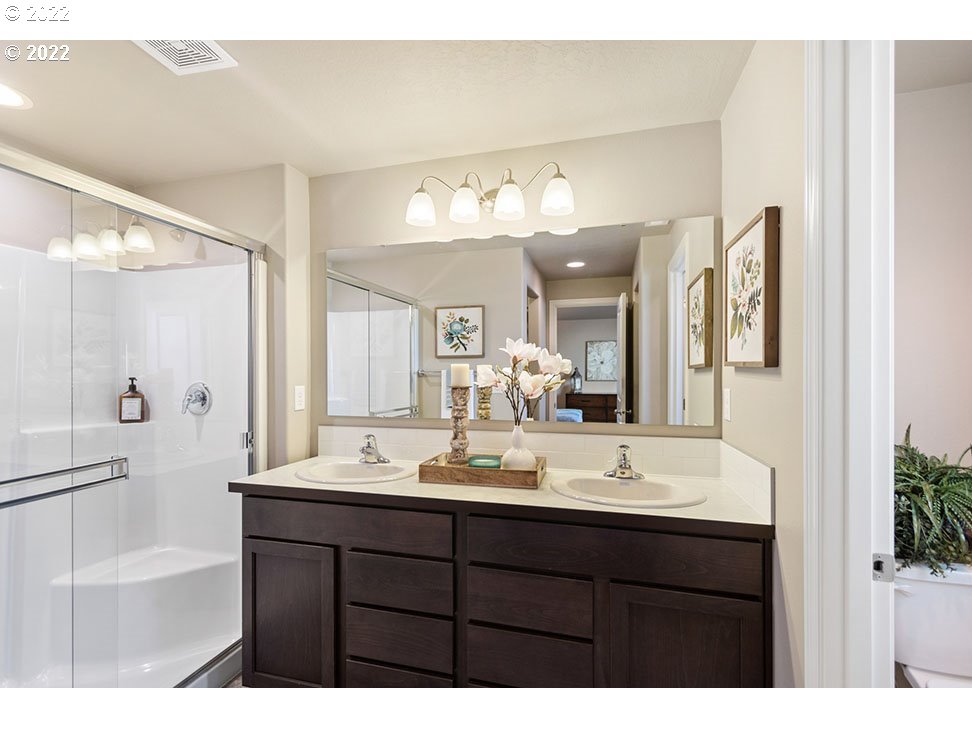 5320 Squirrel Street Springfield, OR 97478 - Photo 5 of 5 a bathroom with a sink vanity tub and a mirror