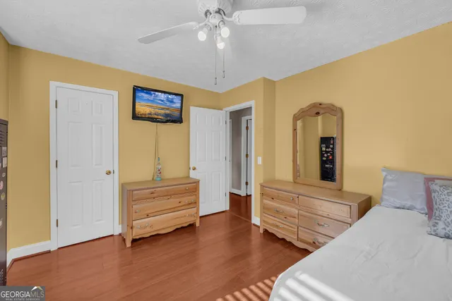 a view of livingroom with hardwood floor and ceiling fan