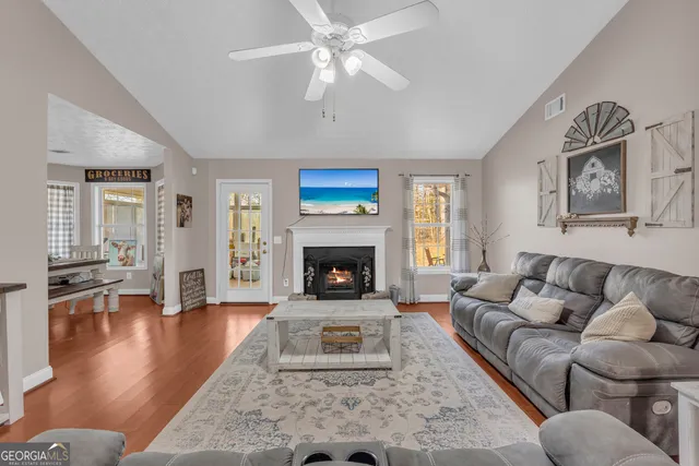 a living room with furniture and a fireplace