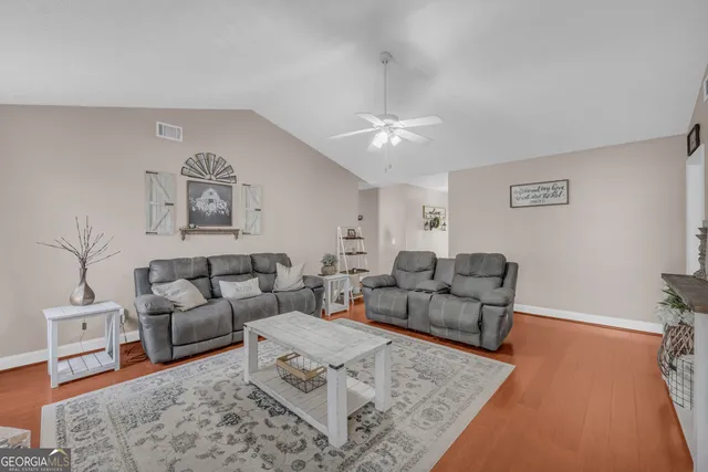 a living room with furniture and a couch