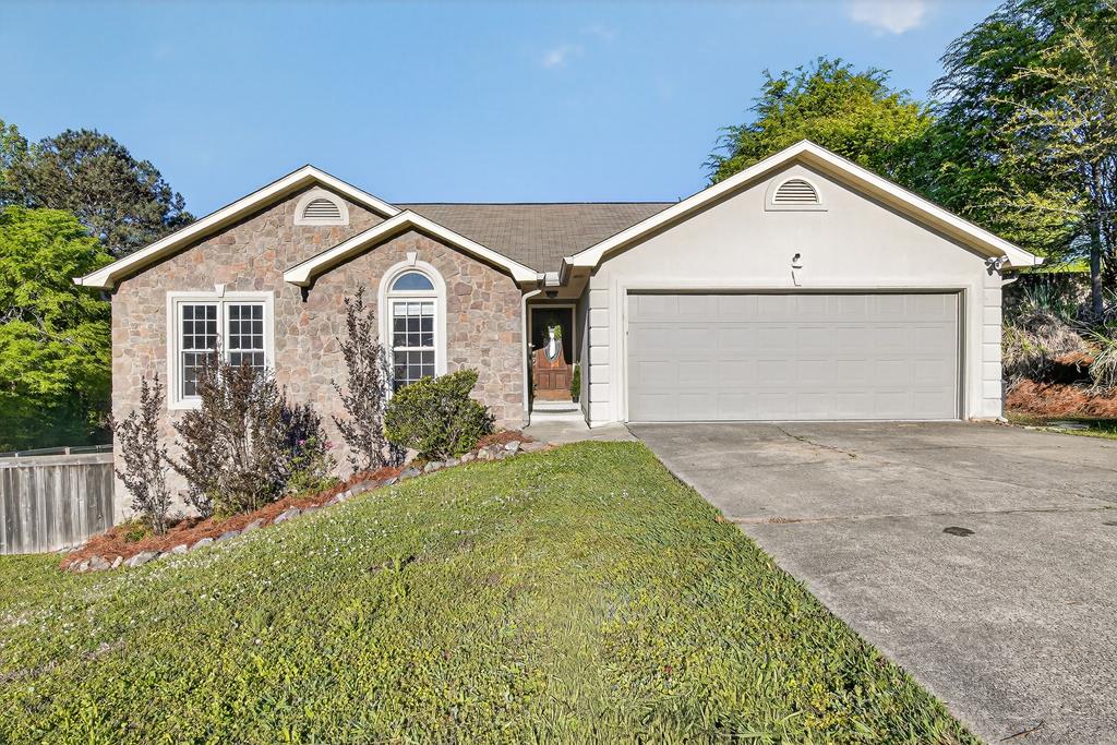 7333 Cedar Creek Loop Columbus, GA 31904 - Photo 1 of 37 a view of front of house with a yard and garage