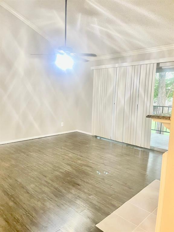 5300 Keller Springs Road, Unit 2080 Dallas, TX 75248 - Photo 28 of 28 a view of an empty room with wooden floor