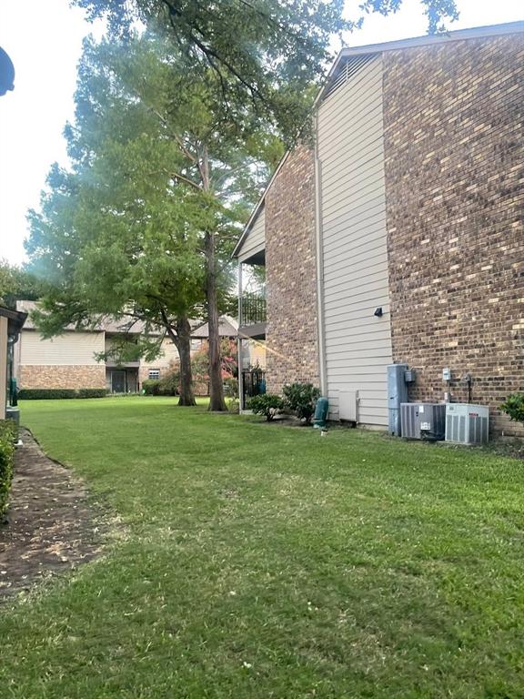 5300 Keller Springs Road, Unit 2080 Dallas, TX 75248 - Photo 3 of 28 a view of a backyard with plants and large trees