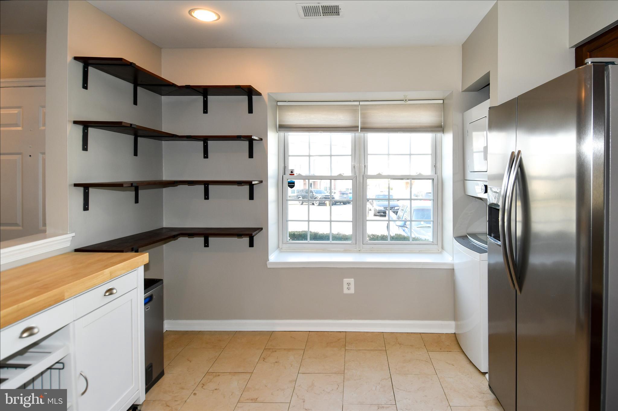 53 Essex Square Sterling, VA 20164 - Photo 3 of 25 a view of kitchen with furniture and a window