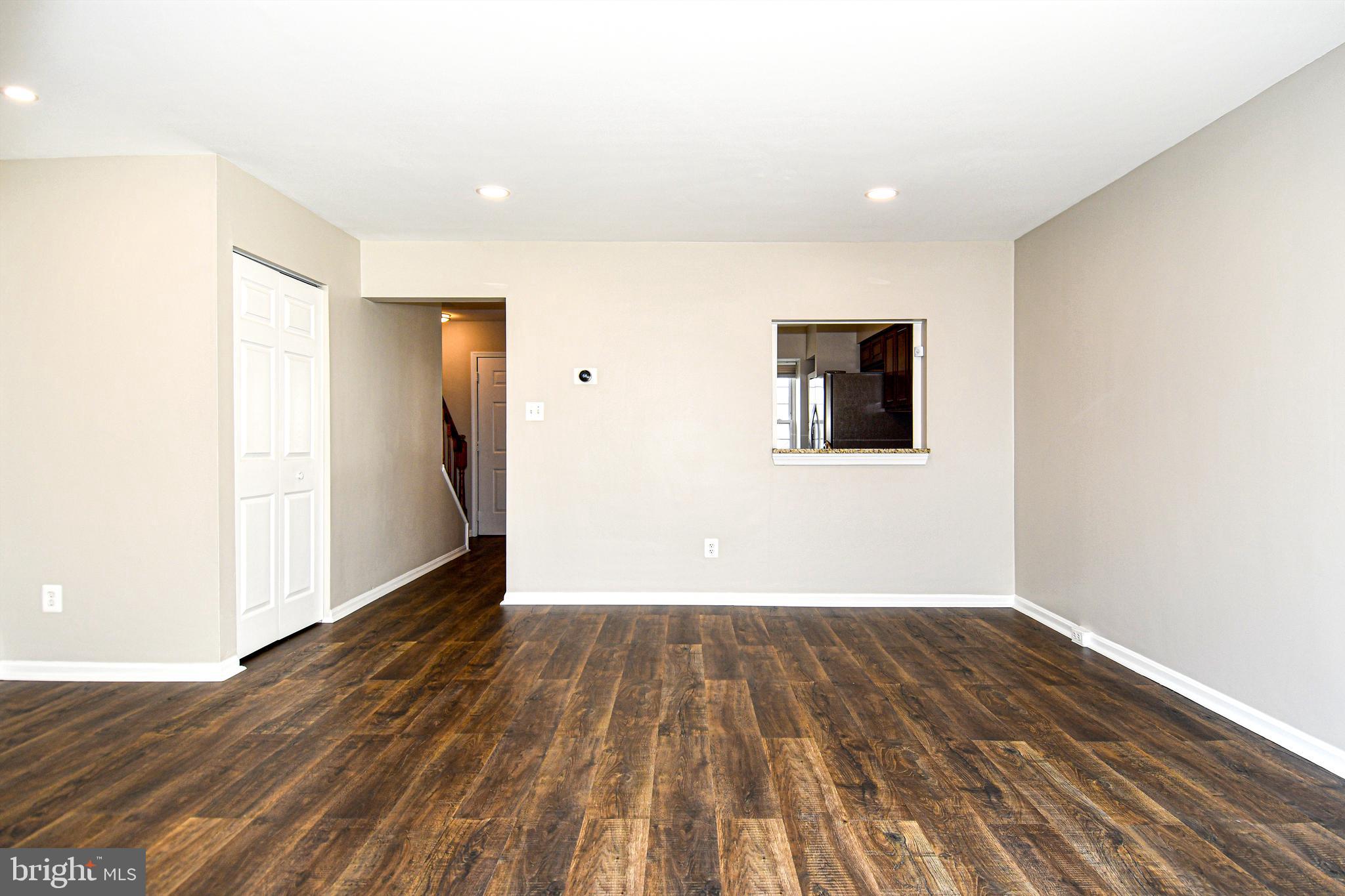 53 Essex Square Sterling, VA 20164 - Photo 4 of 25 a view of an empty room with wooden floor