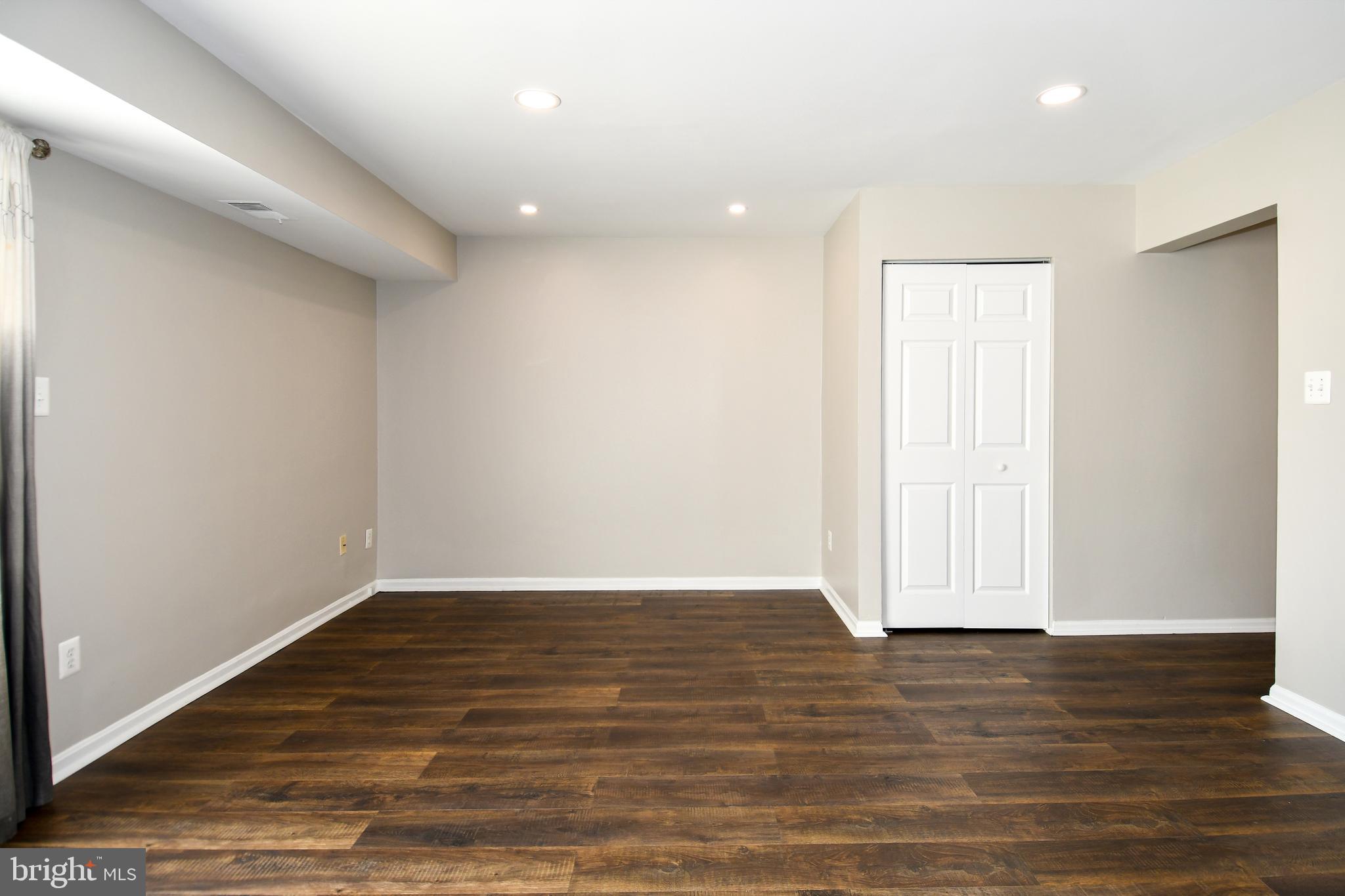 53 Essex Square Sterling, VA 20164 - Photo 6 of 25 a view of room with wooden floor and white walls